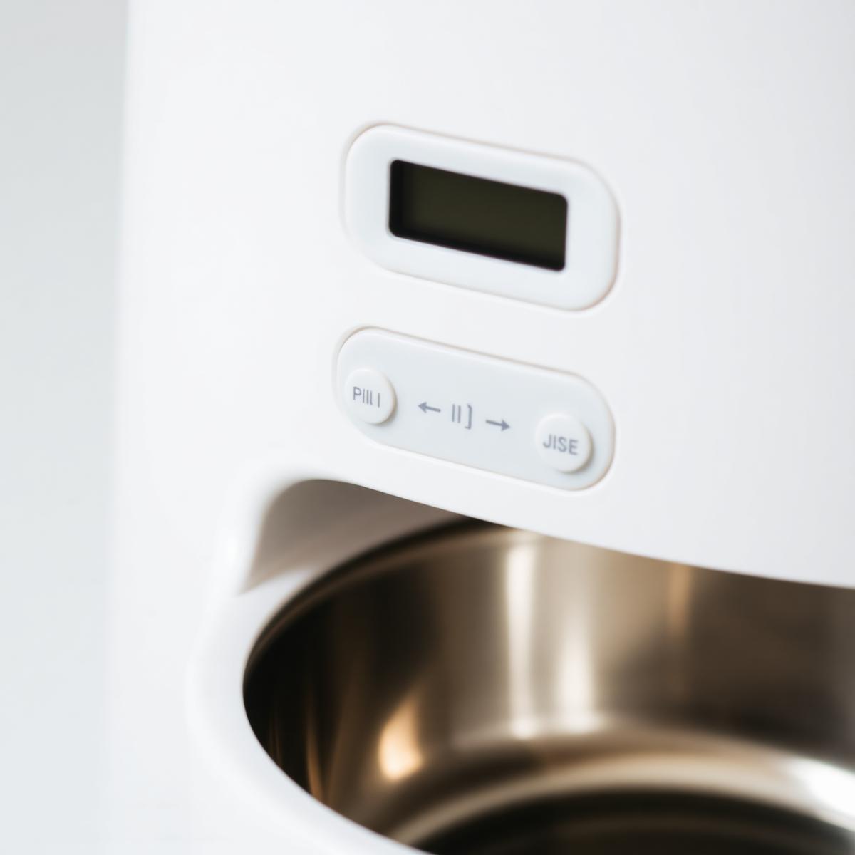 Close-up of the digital control panel and stainless-steel bowl
